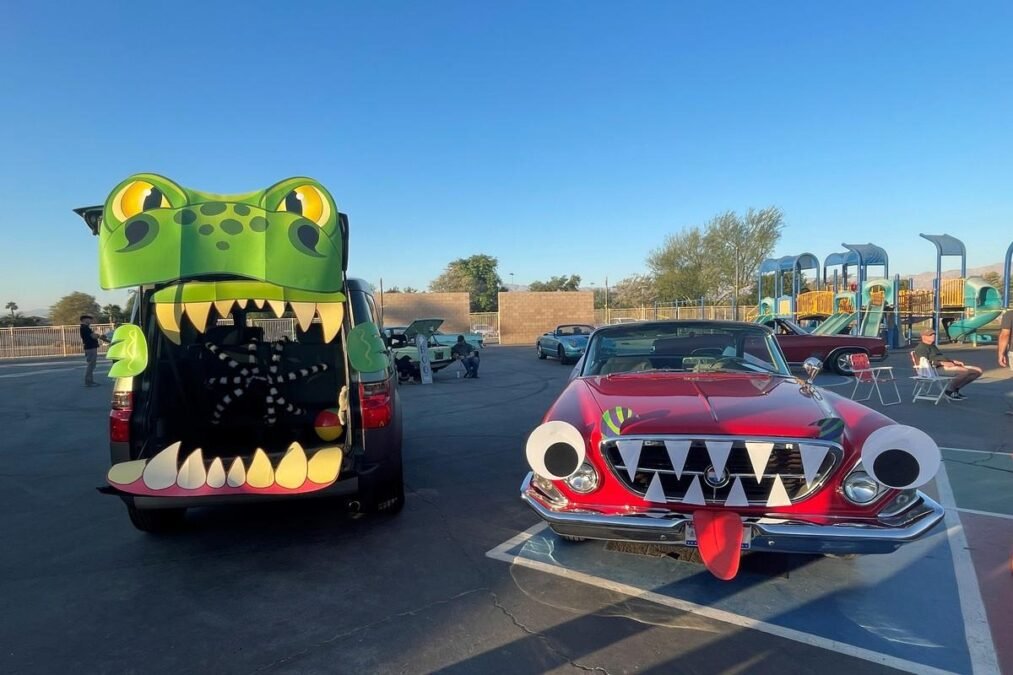 Monster-themed trunk or treat car with colorful eyes and funny monster decorations