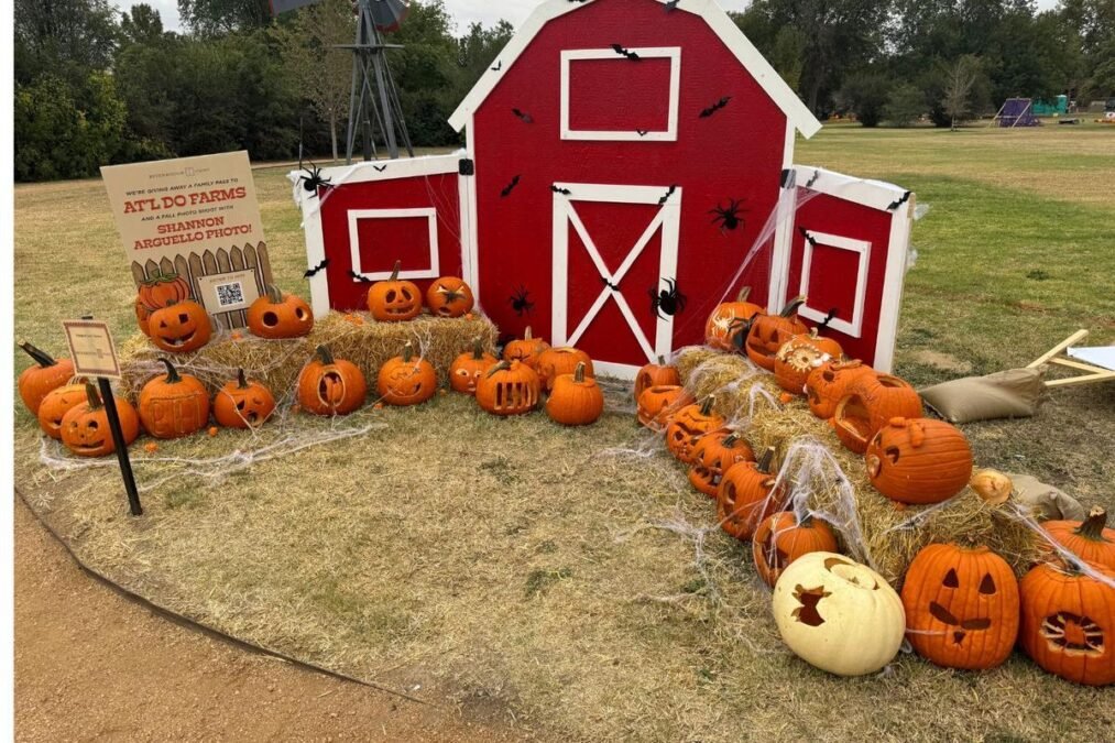 Cute farm pumpkin trunk or treat car with pumpkins, autumn leaves, and a friendly scarecrow